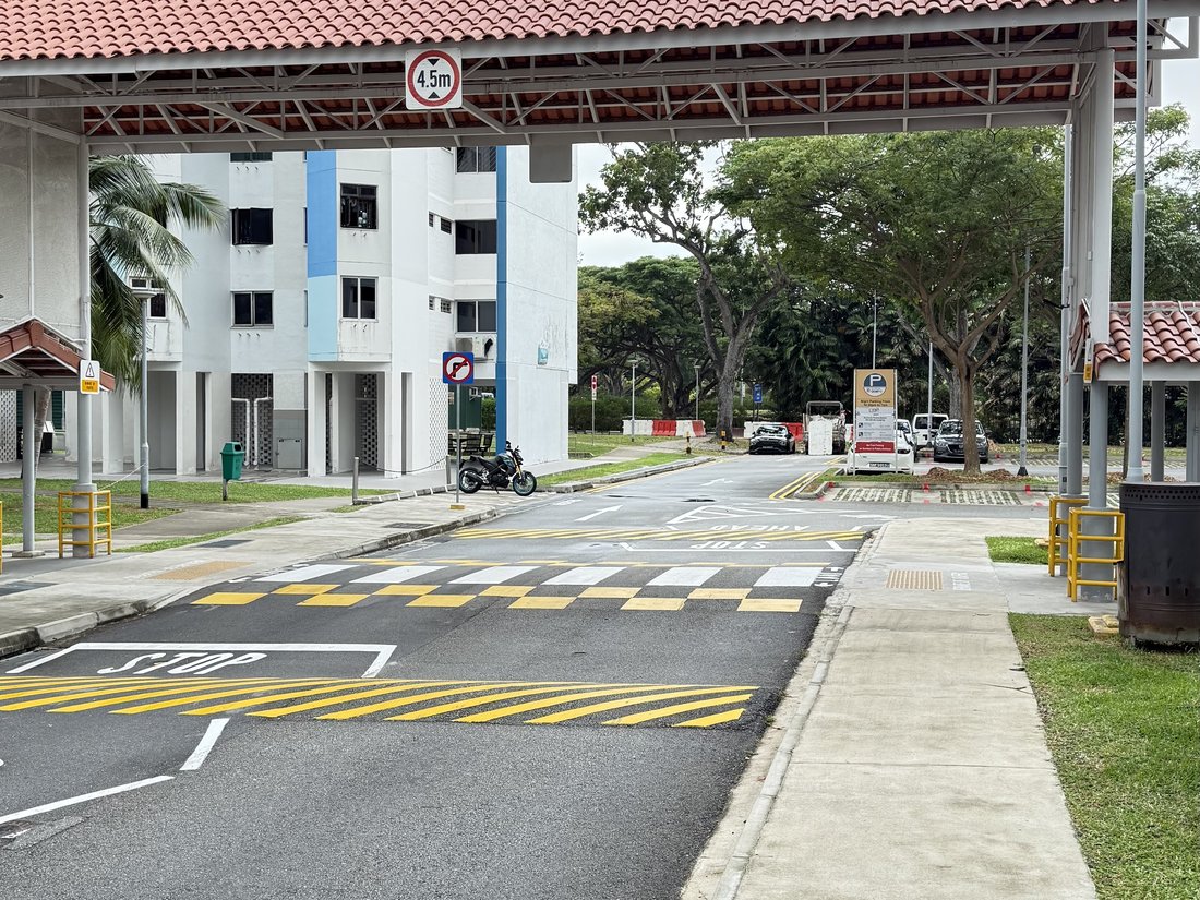 Traffic calming at the 77-63 Marine Drive crossing showing speed humps and STOP markings